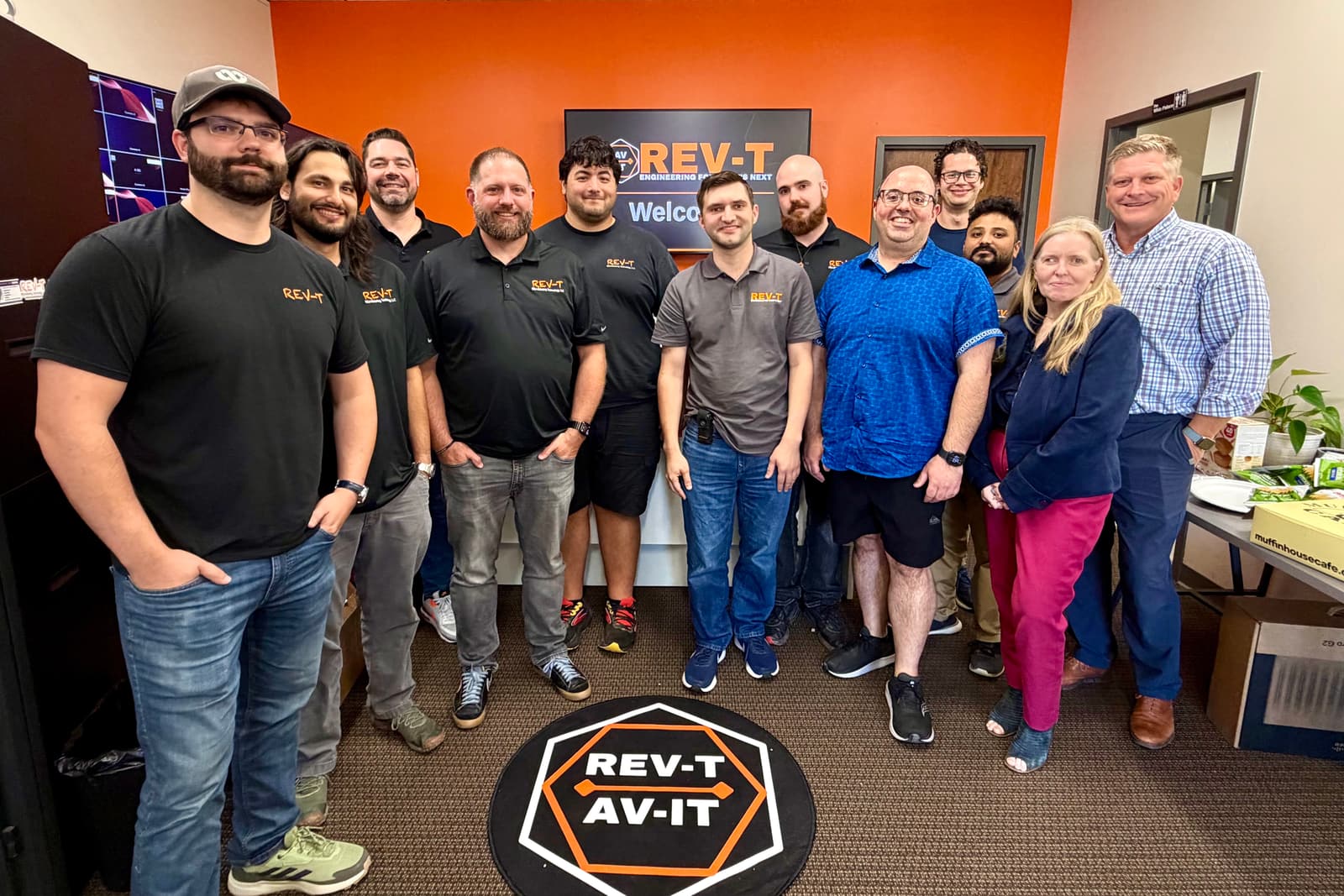 The REV-T team gathered in the front office at the company's Canton, Massachusetts headquarters in 2026.